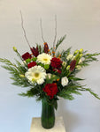 Christmas mixed flowers with berries in a Vase